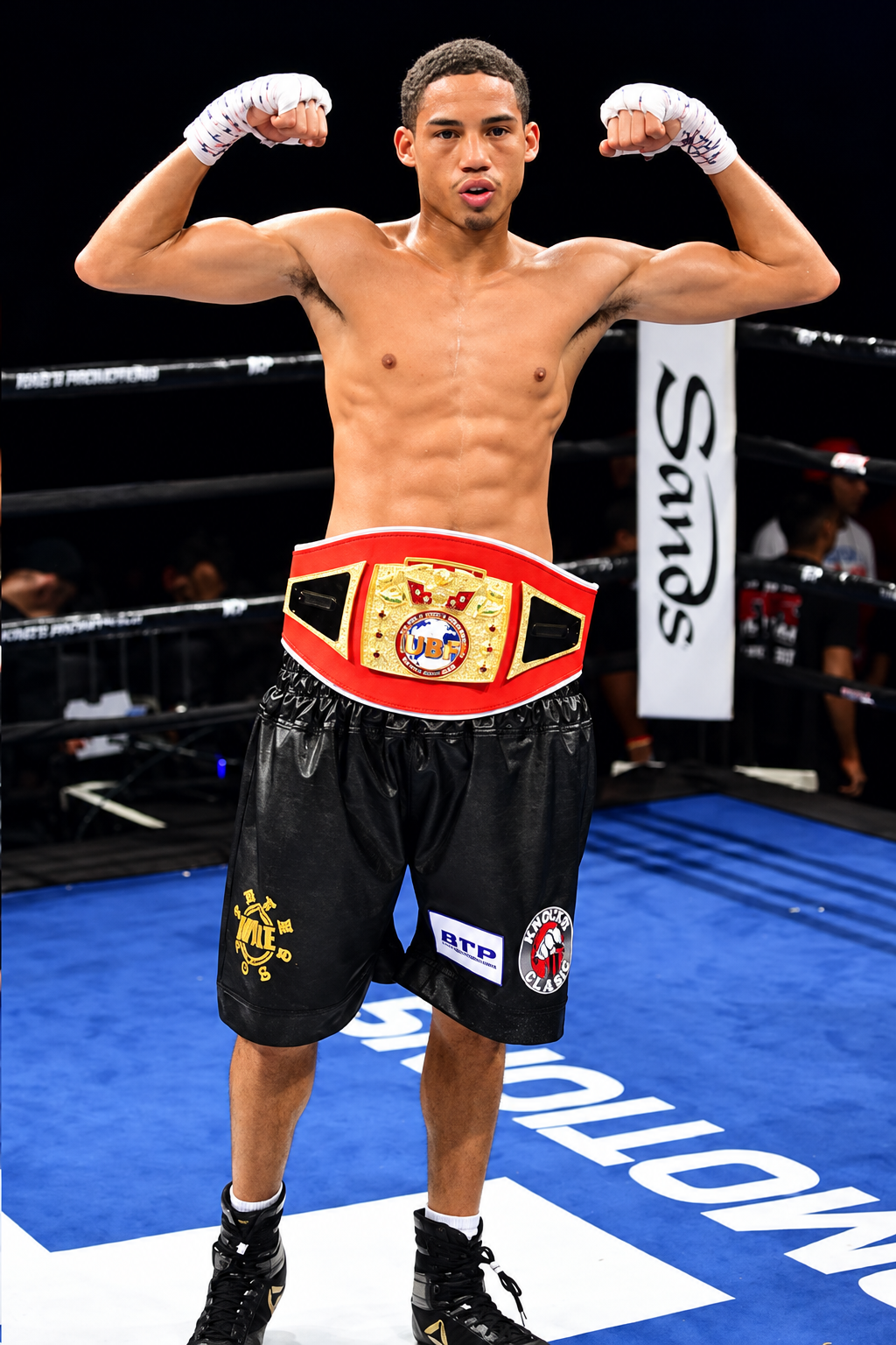 Mykal Fox poses wearing his UBF championship belt in an archival ring photograph.